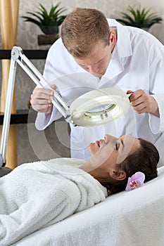 Woman having facial treatment