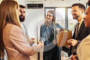 Woman having first working day getting acquainted with colleagues