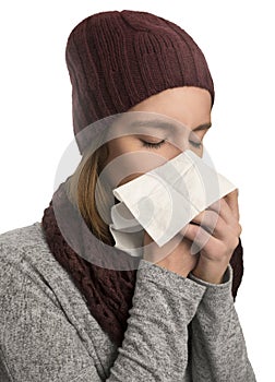 Woman having flu, feeling bad and blowing her nose