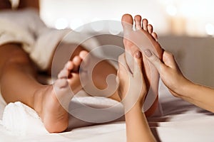 Woman Having Foot Massage, Relaxing In Spa Salon