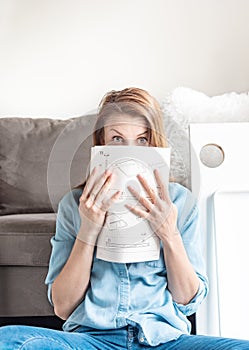 Woman having fun assempling DIY furniture