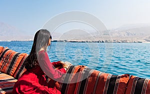 Woman having fun on a dhow boat cruise