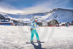 Woman, having fun and learning how to ride on a snowboard, Andorra