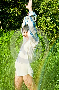 Woman having fun in summer rain