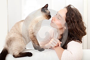 Woman having good times at home with cat