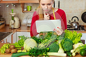 Woman having green vegetables thinking about cooking