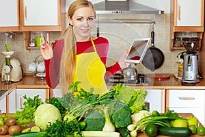 Woman having green vegetables thinking about cooking