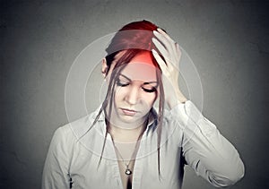 Woman having a headache with her head in her hand