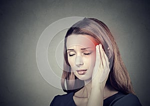 Woman having headache, migraine photo