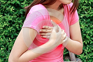 Woman having heart attack at outdoor - Angina Pectoris, Myocardial Infarction.