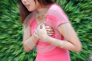 Woman having heart attack at outdoor - Angina Pectoris, Myocardial Infarction.