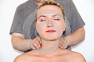Woman having her neck massaged