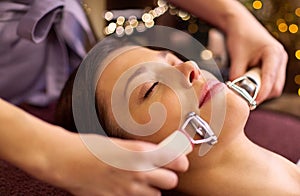 Woman having hydradermie facial treatment in spa