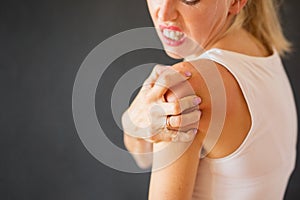 Woman having itchy skin disease