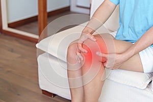 Woman having knee ache and muscle pain due to Runners Knee or Patellofemoral Pain Syndrome, osteoarthritis, arthritis, rheumatism