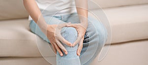 woman having knee ache and muscle pain due to Runners Knee or Patellofemoral Pain Syndrome, osteoarthritis, arthritis, rheumatism