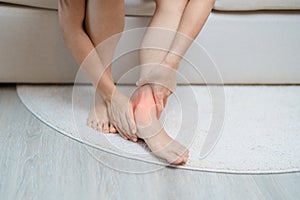 woman having leg pain due to Ankle Sprains or Achilles Tendonitis and Shin Splints ache. injuries, health and medical concept photo