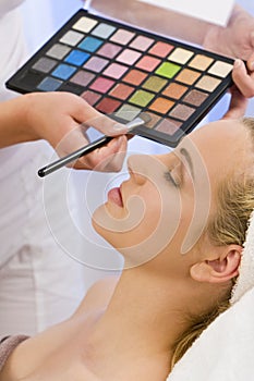 Woman Having Make Up Applied by Beautician at Spa