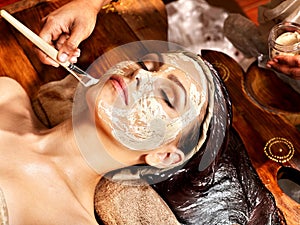 Woman having mask at ayurveda spa. photo