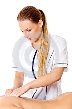 Woman having massage of body in the spa salon. Beauty treatment concept.