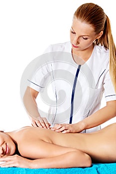 Woman having massage of body in the spa salon. Beauty treatment concept.