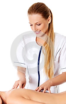 Woman having massage of body in the spa salon. Beauty treatment concept.