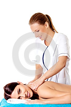 Woman having massage of body in the spa salon. Beauty treatment concept.