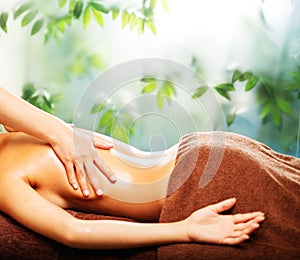 Woman having massage in a spa