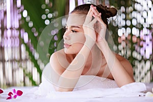 woman having massage in the spa salon, beauty, health care body skin natural herbs and essential oils treatment. concept