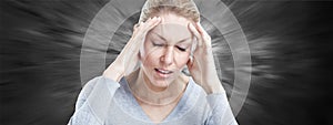 Woman having a migraine headache.