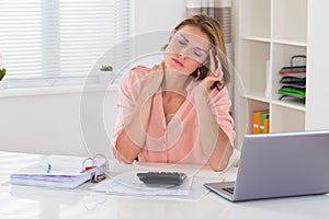 Woman Having Neckache At Desk