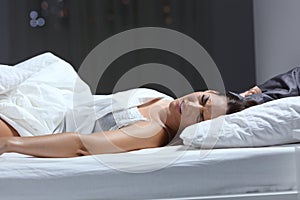 Woman having a nightmare in the bed in the night photo