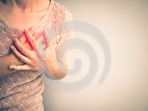 Woman having a pain in the heart attact.