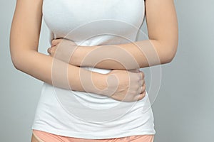 Woman having painful stomachache.Chronic gastritis. .Women are menstrual period, causing abdominal pain