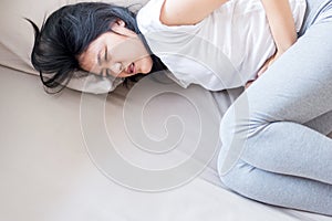 Woman having painful stomachache,Female suffering from abdominal pain photo