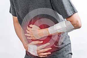 Woman having painful stomachache on white background