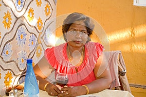 Woman having a pre-dinner drink. photo