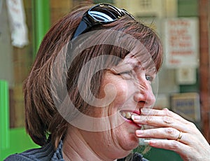 Woman having a private chuckle photo