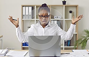 Woman having problem due to error or mistake on her laptop computer at work in office