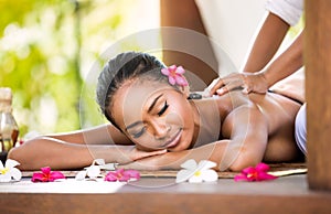 Woman having relaxing massage in spa salon