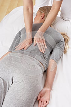 Woman having Shiatsu massage