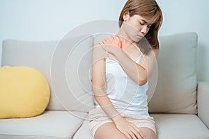 Woman having Shoulder and Neck pain at home. Muscle painful due to Myofascial pain syndrome and Fibromyalgia, rheumatism, Scapular