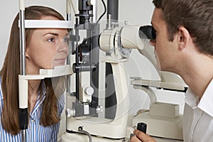 Woman Having Sight Test At Opticians