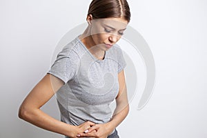 Woman having a stomachache, or menstruation pain, Health care and medical concept.