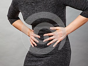 Woman having strong stomach ache. Syndroms photo