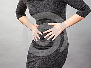 Woman having strong stomach ache. Syndroms photo