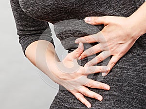 Woman having strong stomach ache. Syndroms photo