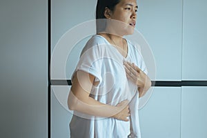 Woman having or symptomatic reflux acids,Gastroesophageal reflux disease,Because the esophageal sphincter that separates the esoph photo