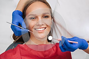 Woman having teeth examined at dentist.