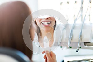 Woman having teeth examined at dentists photo